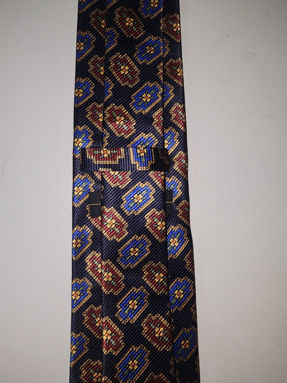 Jos. A. Bank Navy Silk Tie with Gold, Red, Blue & Green Geometric Motif - Picture 3 of 3